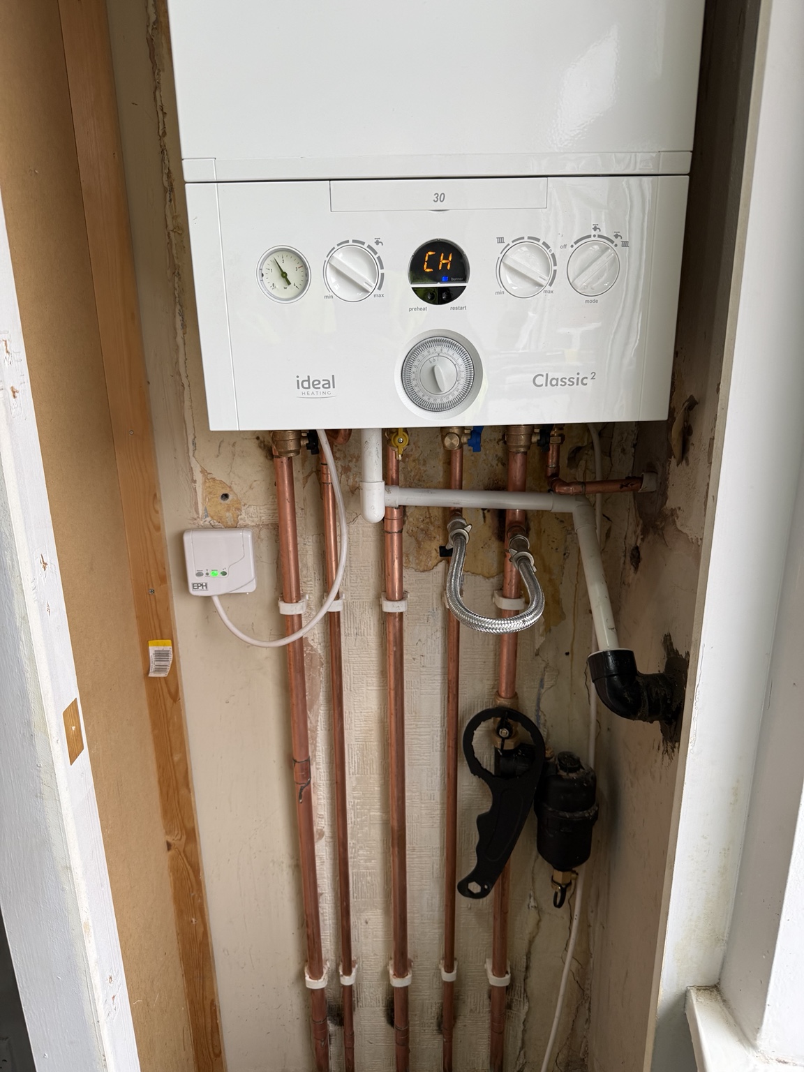 Ideal Classic Combi boiler installation completed by Redmond Heating Services with neatly installed copper pipework and wireless heating controls.